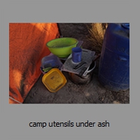camp utensils under ash